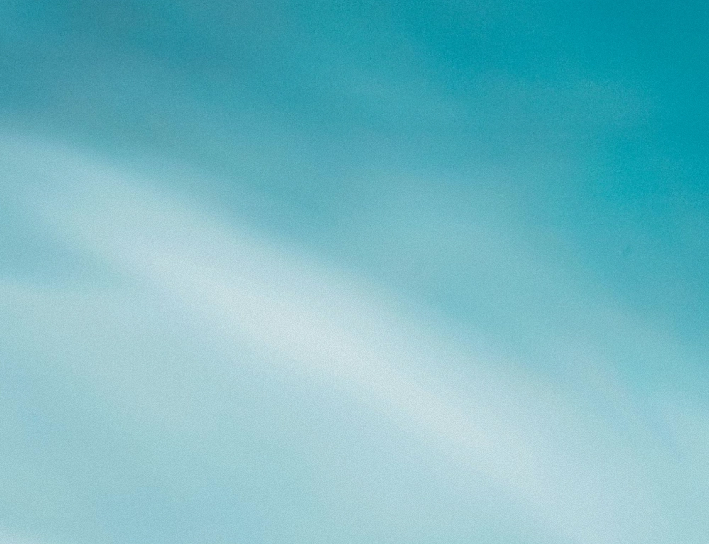 Soft gradient of blue and light teal shades blending smoothly.