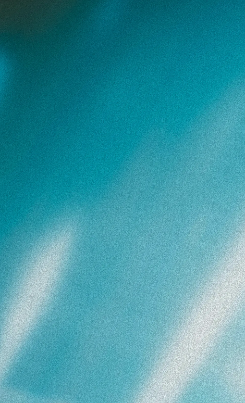 Abstract blue and teal gradient with soft blurred light streaks.